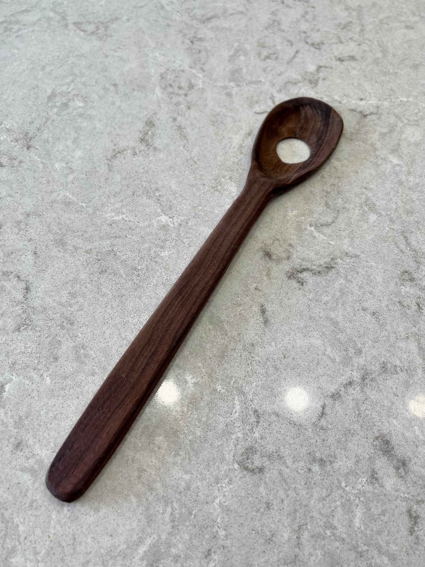 Walnut spoon with hole